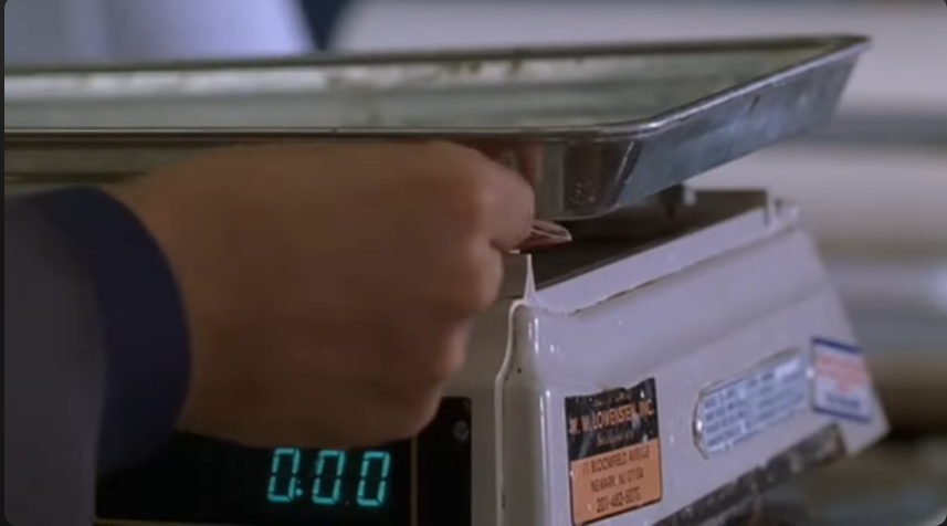 Matchbook underneath a scale